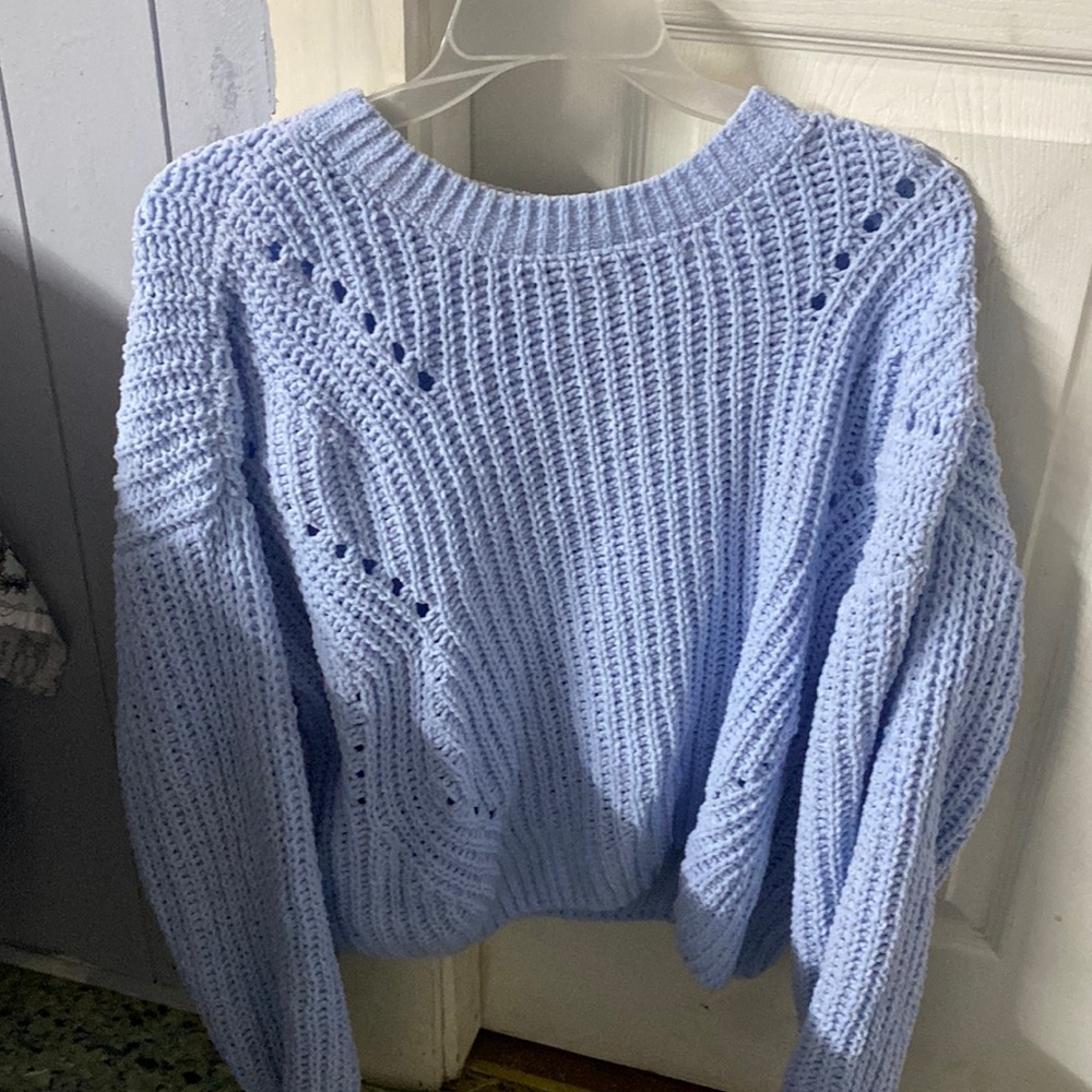 Size large the brand is SO/Kohls baby blue sweater .